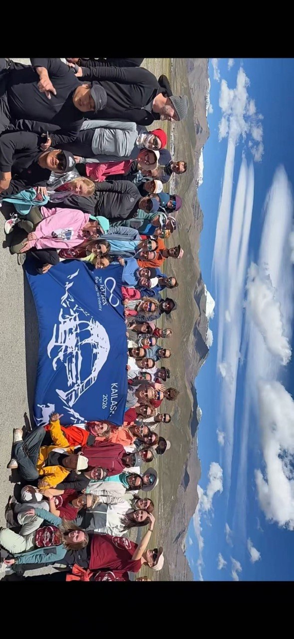 Tour group smiling together in Tibet